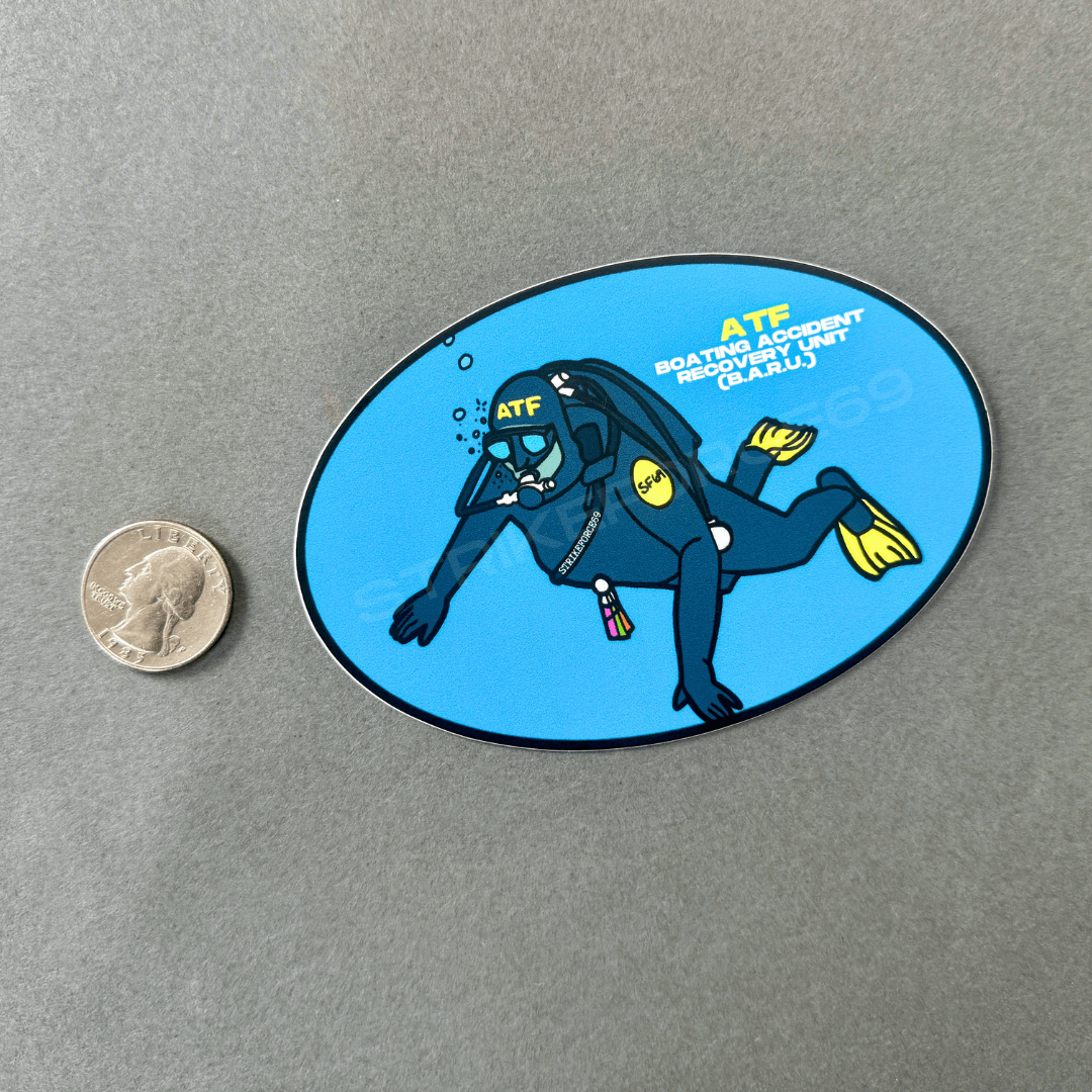 comparing my ATF BARU sticker to a quarter for size